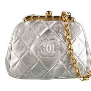 Chanel evening bag silver with a gold plated chain very minor wear.